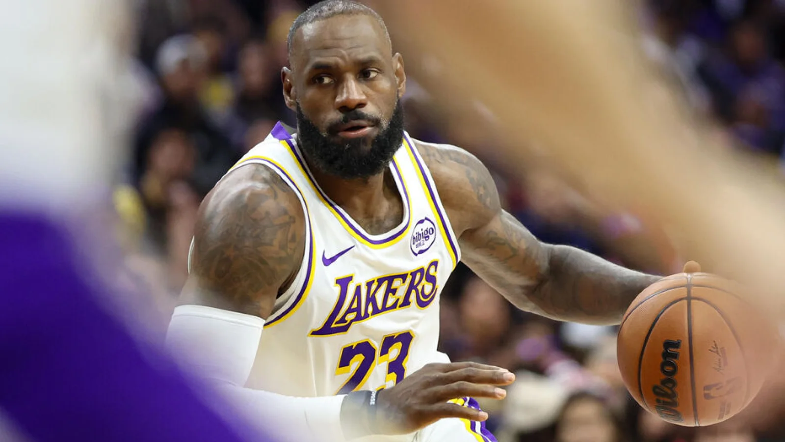 LeBron James of the Los Angeles Lakers bringing the ball up the court during a game. The veteran forward is evaluating his future ahead of summer free agency and potential contract extension talks.