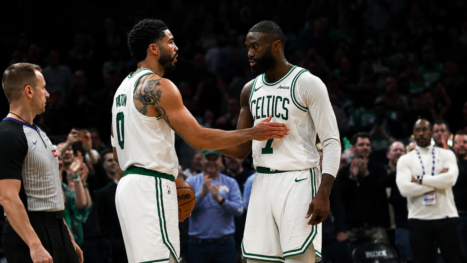 Jayson Tatum playing for the Boston Celtics before reacting to the Jaylen Brown trade