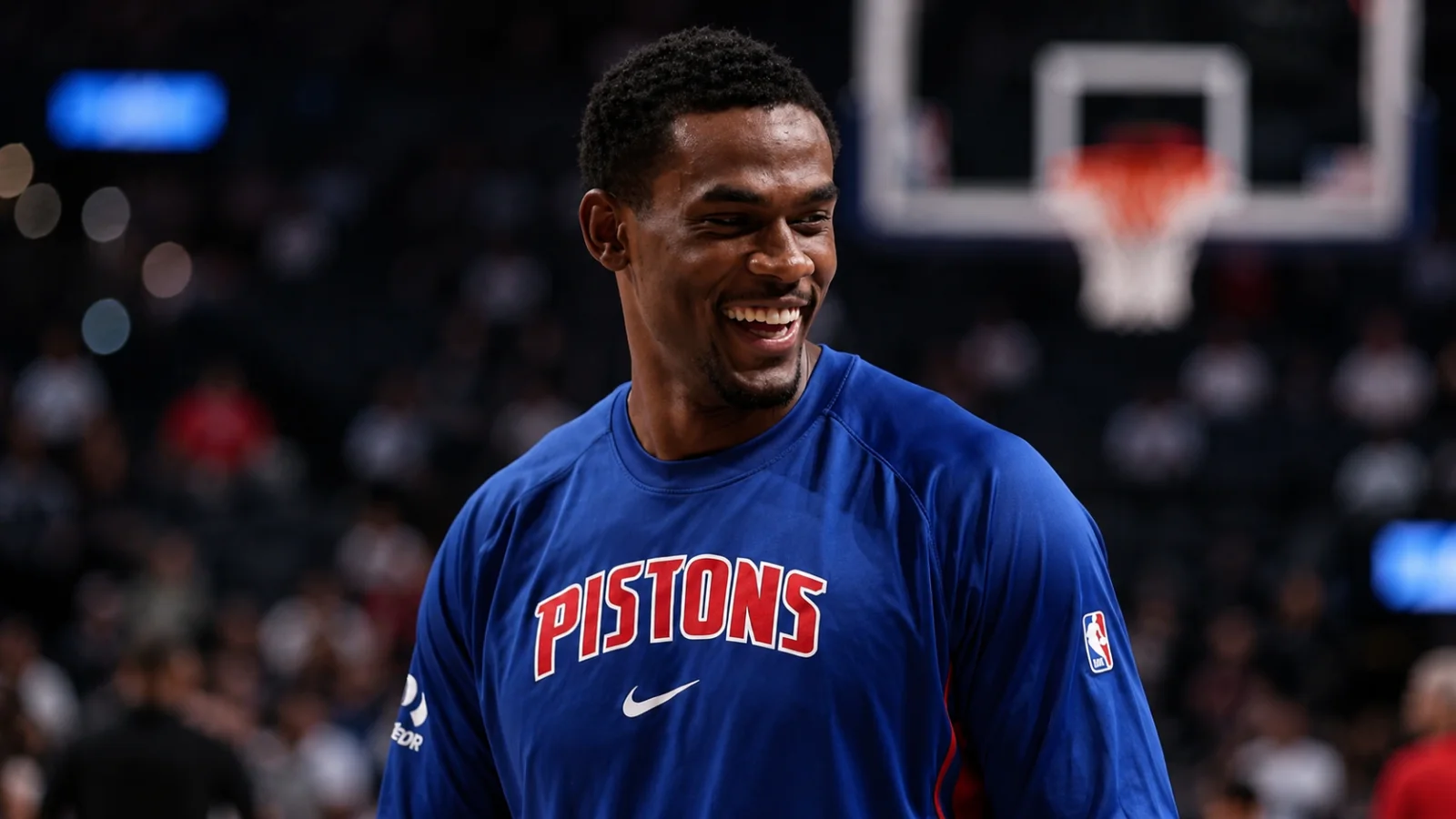 NBA center finishing near the basket during a game