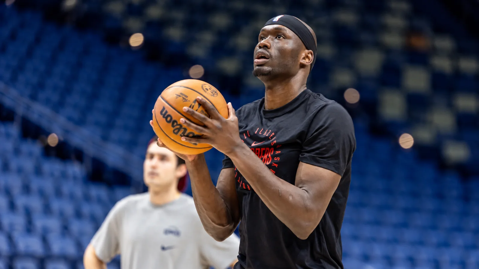 NBA frontcourt player contesting near the basket