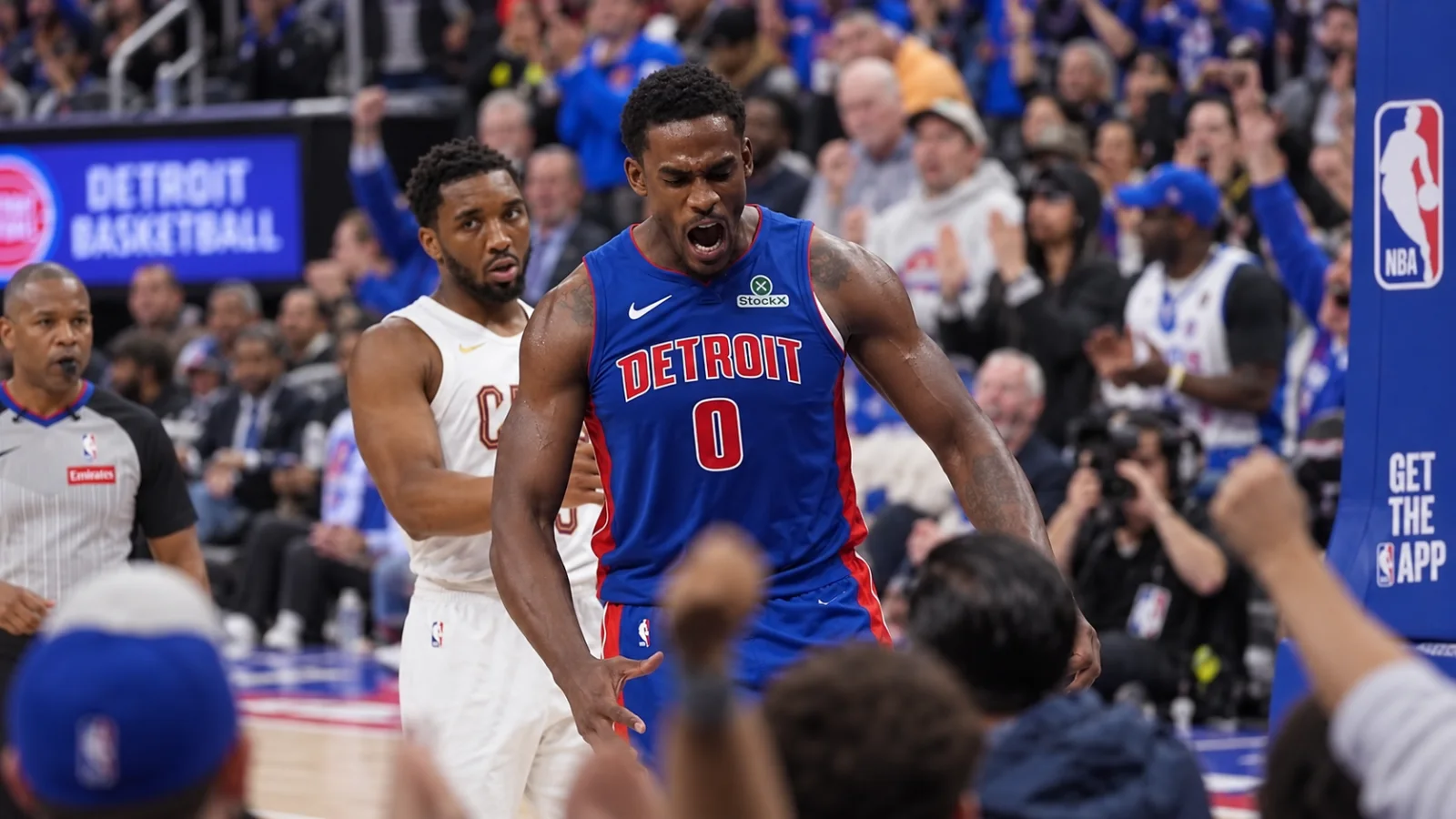 NBA center finishing at the rim during a game